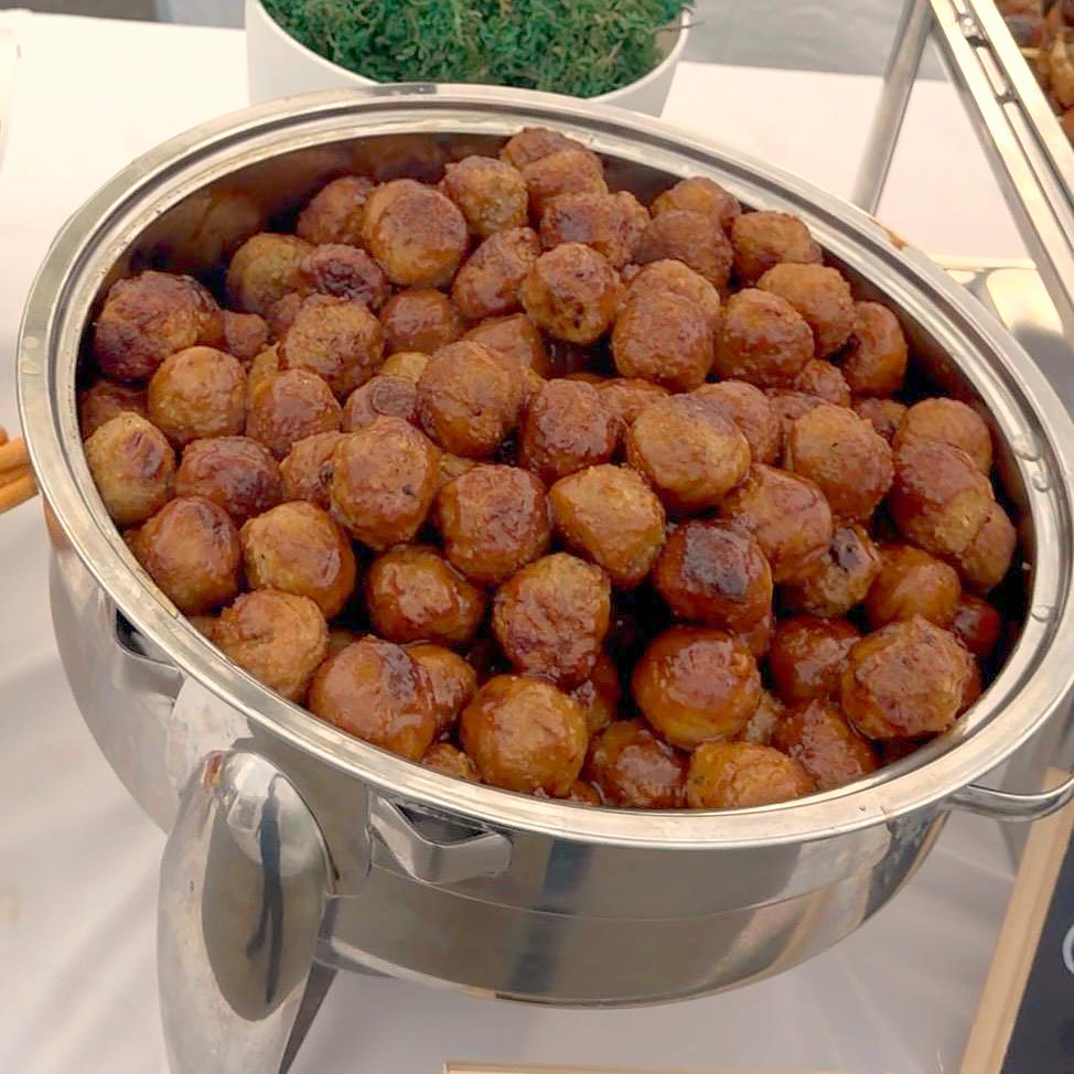 Glazed meatballs in a round chafing dish